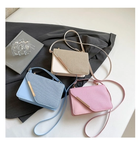 Three elegant small square handbags in cream, light blue and pink with metal buckle