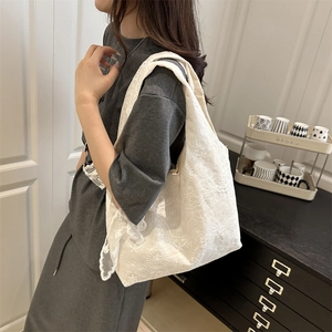 Elegant white floral lace tote bag for women showing spacious interior and soft shoulder strap