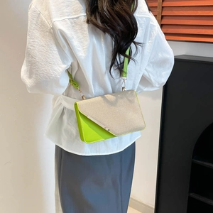Fashion crossbody square bag with beige weave and green faux leather in a casual setting