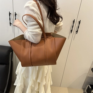 Classic caramel brown tote bag in premium faux leather with minimalist shoulder straps