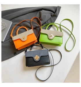Three mini crossbody bags in orange, green, and black with floral metal twist locks