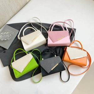 Fashionable patchwork crossbody bags in five colors with sleek gold metal bar detail