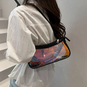Holographic PVC shoulder bag with black trim and gold zipper shown on a model