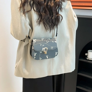 Lace floral embroidery crossbody bag in blue-gray with gold buckle and leather strap