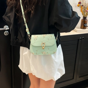 Chic mint green crossbody bag with floral lace embroidery and golden clasp