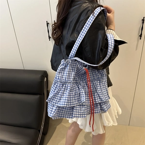 Blue gingham ruffle tote bag with red drawstring closure and layered frill design