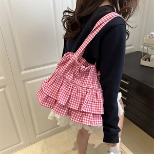 Red and white checkered canvas tote bag with ruffled layers for a stylish summer look