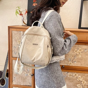 Chic beige nylon backpack for women, spacious and lightweight for travel and commuting