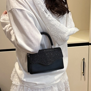 Elegant black handbag with sparkling sequins and top handle for modern women fashion