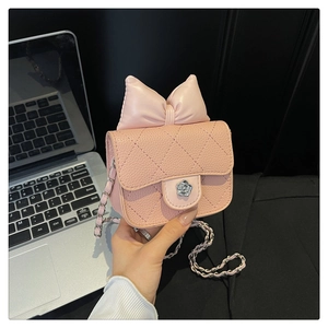 Pink quilted crossbody bag with decorative bow and silver camellia flower metal clasp