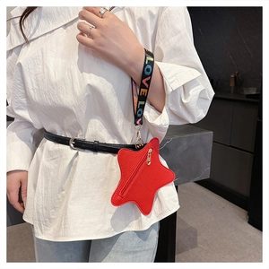 Macro shot of a red star-shaped coin purse attached to a belt with a colorful LOVE lanyard