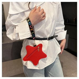 Star-shaped red leather coin purse with contrast LOVE lettered strap detail close-up