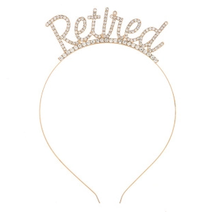 Detail of a golden metal headband featuring sparkling rhinestones spelling Retired word