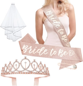 Rose gold bride to be sash with sparkling tiara and white tulle veil for bachelorette party