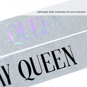 Detail of silver glitter sash with Birthday Queen black and holographic lettering