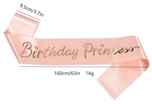 Close-up of pink satin birthday sash with rose gold Birthday Princess lettering
