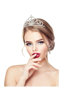 Detailed close-up of a silver crystal bridal crown and matching drop earrings on a model