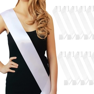 Detailed view of nine blank white satin sashes for DIY party decoration and pageant events
