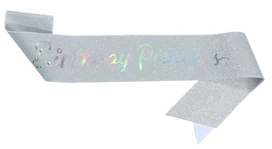 Macro shot of silver glitter sash with holographic Birthday Princess text detail