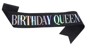 Detail of black glitter Birthday Queen sash with rainbow laser lettering for parties