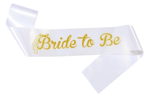 Detail of white satin Bride to Be sash with sparkling gold glitter text and crown icon