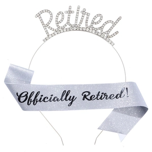 Detail of glittery Retired tiara and light blue Officially Retired sash party set