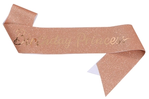 Detailed close-up of rose gold glitter birthday princess sash with elegant gold lettering