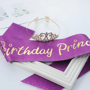 Close-up of Birthday Princess purple glitter sash and golden crystal tiara set