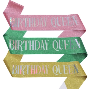 Three glitter Birthday Queen sashes in pink, green, and gold colors for party celebration