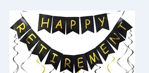 Detail of Happy Retirement black and gold swallowtail banner with spiral decorations
