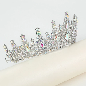 Detailed close-up of a silver crown with sparkling AB rhinestones for birthday parties