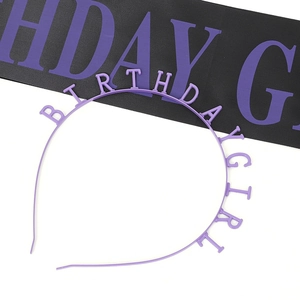 Detail of purple Birthday Girl headband and sash set for party celebration decorations