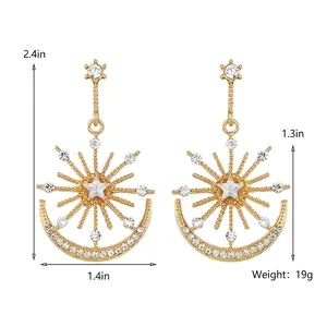 Elegant gold-tone sun and moon drop earrings featuring sparkling crystal rhinestones