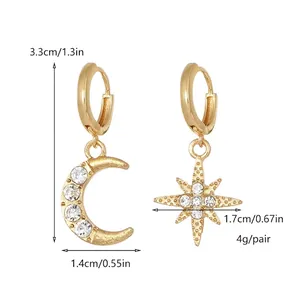 Asymmetric gold earrings with rhinestone encrusted star and moon dangles, 3.3cm length