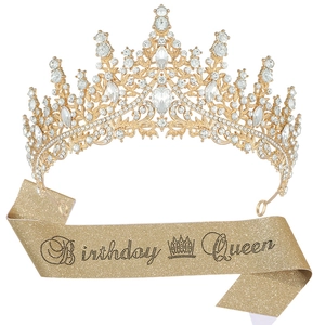 Detailed view of sparkling rhinestone tiara and golden Birthday Queen sash for women