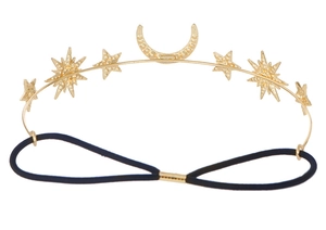 Detailed view of Baroque gold moon and stars charms on a black elastic headband