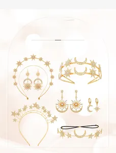 Detailed view of Bohemian gold star and moon bridal tiaras with sparkling rhinestones