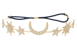 Detailed macro view of golden baroque celestial headband with rhinestones and moon star charms