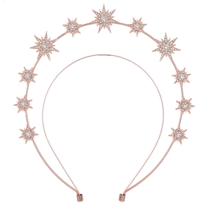 Detail of rose gold celestial crown with crystal stars and moon in bohemian style