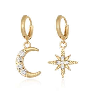 Gold asymmetrical hoop earrings with sparkling rhinestone star and crescent moon pendants