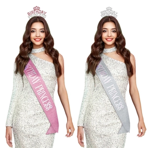 Close-up of glitter Birthday Princess sash and tiara sets in pink and silver