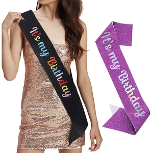Close-up of glittery birthday sash with colorful 'it's my birthday' text for party decor