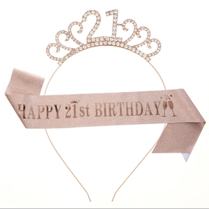 Detail of rose gold 21st birthday tiara and glitter sash set with rhinestones