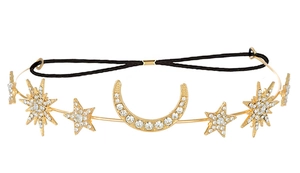 Detailed view of bohemian gold headband with sparkling rhinestone stars and moon charm