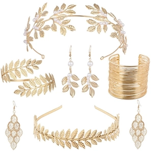 Detailed set of golden goddess headbands and leaf jewelry with pearls on white background