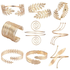 Detailed set of nine adjustable gold alloy arm cuffs and bangles with vintage leaf designs