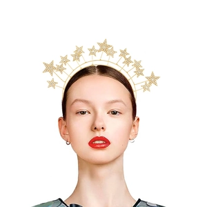 Golden celestial crown headband with sparkling rhinestone stars in a sunburst design