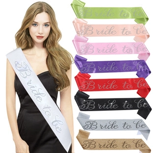 Detail view of colorful Bride to Be satin sashes with silver lettering for bachelorette parties