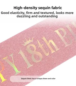 Detail of pink glitter fabric sash with Happy 18th Birthday and crown gold stamping