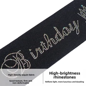 Close-up of Birthday Queen sash with sparkling rhinestones on black glitter fabric